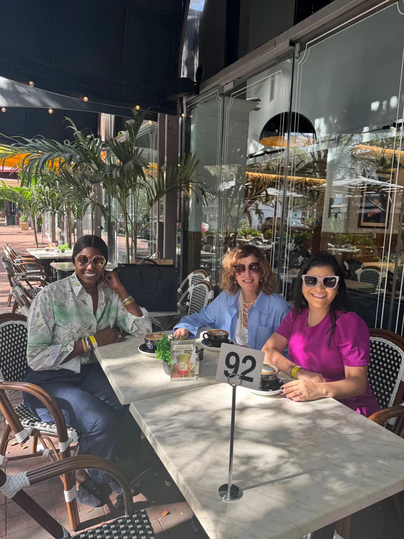 Spry Society community gathering over coffee in an outdoor café setting